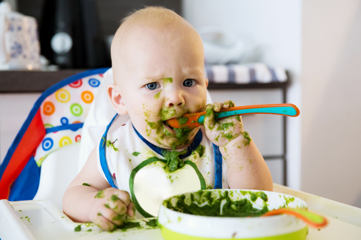 baby boy eating veggie puree
